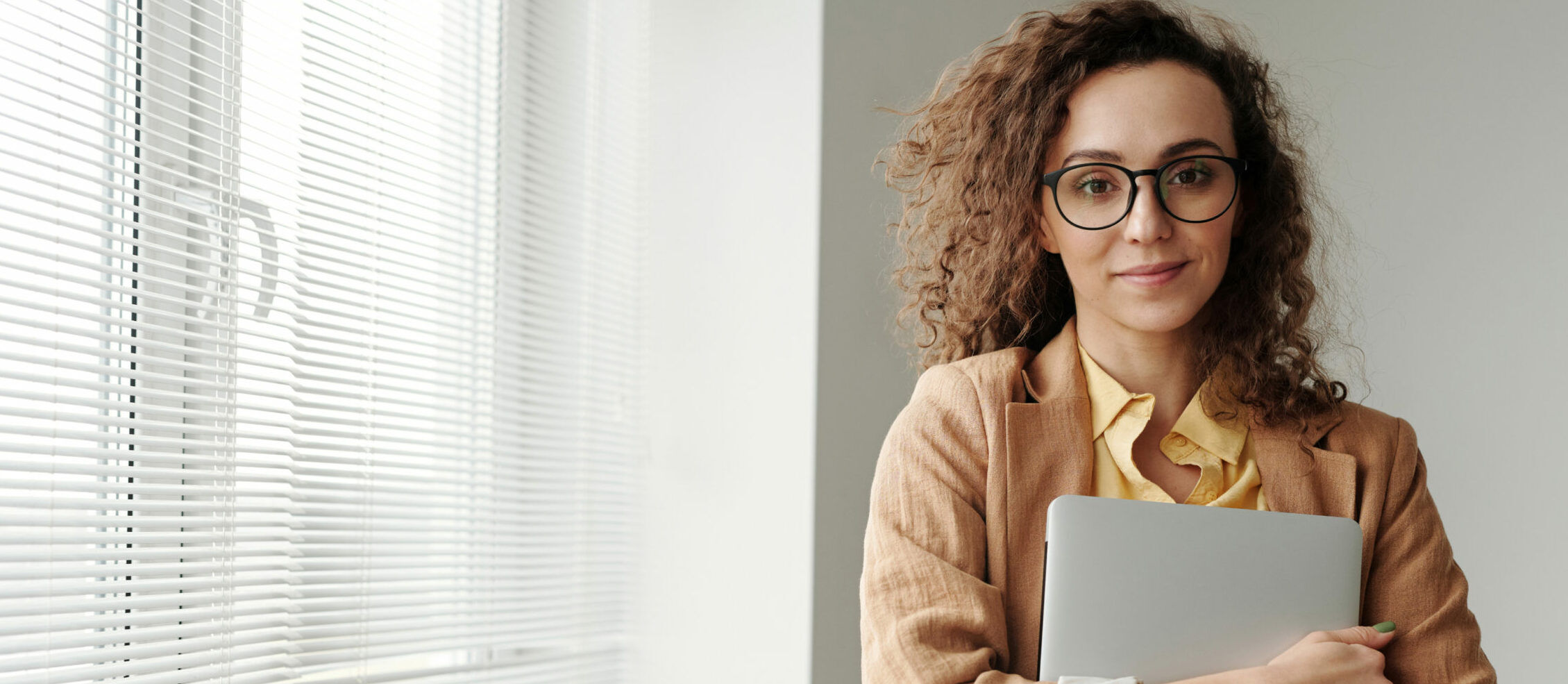 Woman Holding Laptop